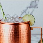 Picture of a moscow mule recipe with ice and a straw