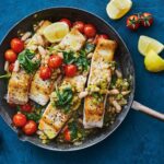 White fish fillets cooked with tomatoes and herbs in a single pan.