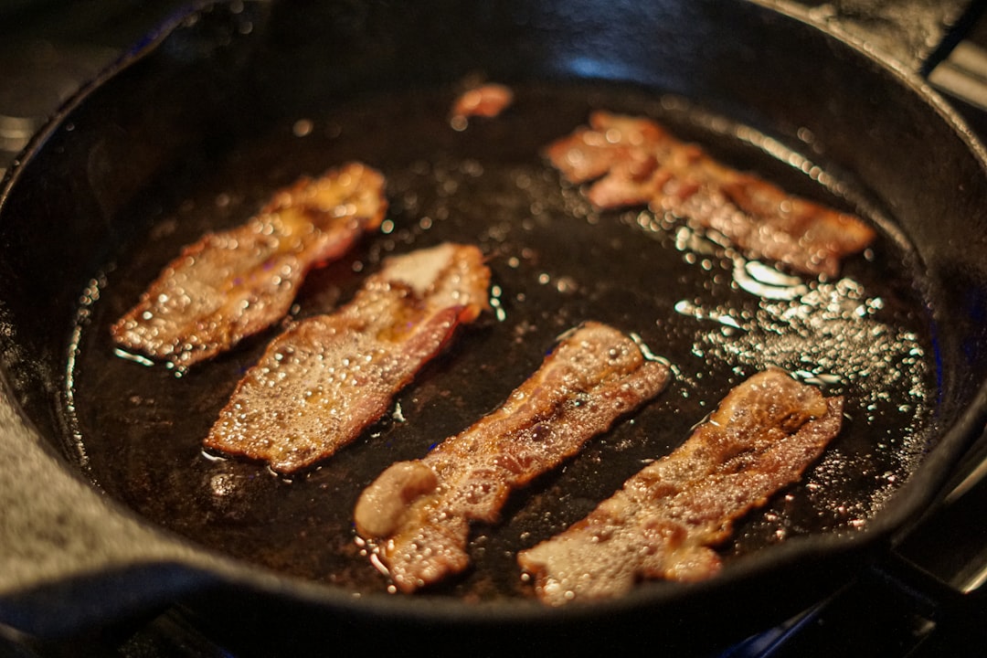 Step-by-step shots showing chicken thighs being seared until golden brown in a cast iron skillet with ingredients arranged nearby
