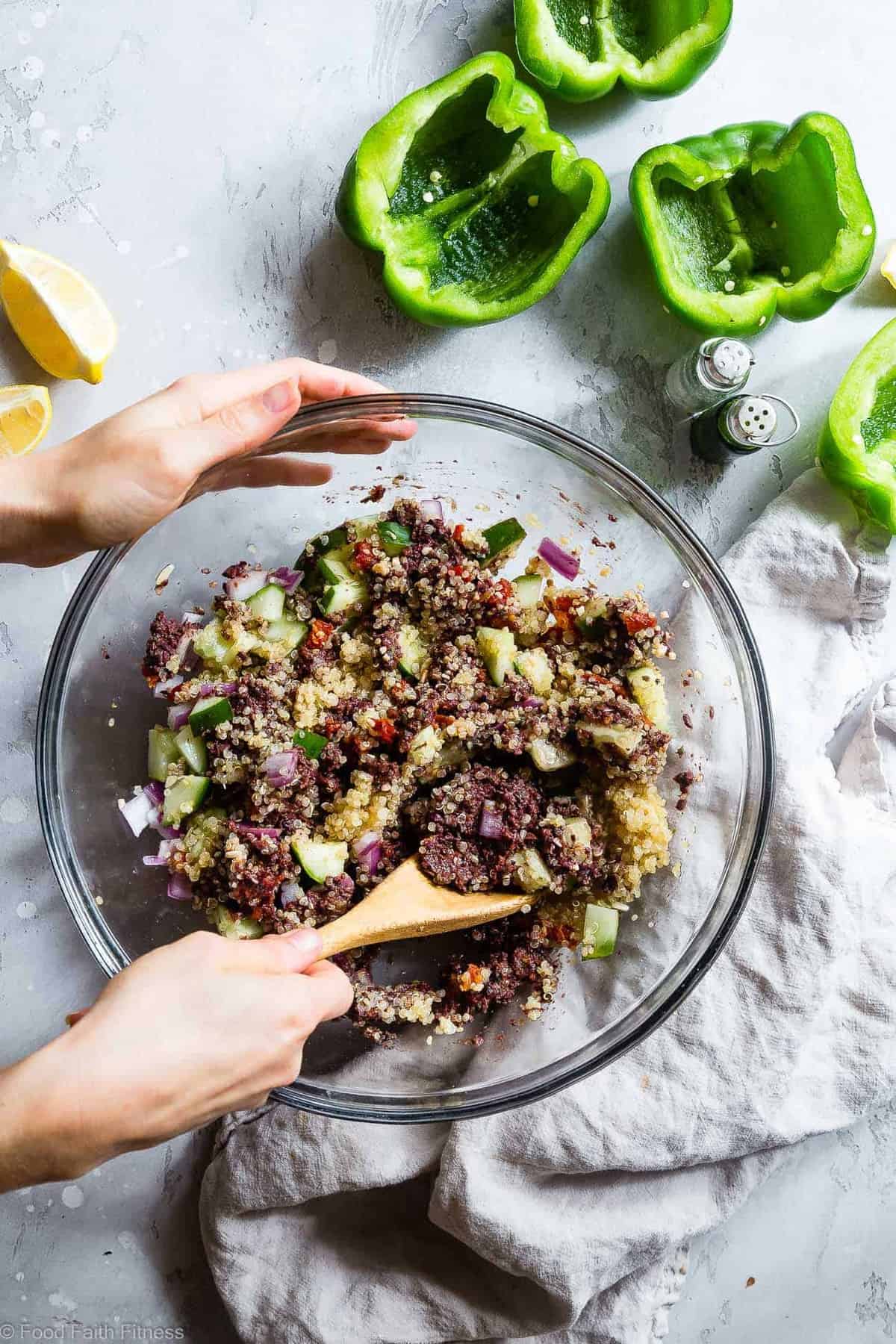 Flat lay ingredients shot showing halved bell peppers, ground turkey, cooked quinoa, feta cheese, spices, and fresh herbs on a light marble surface